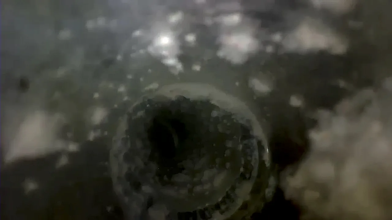 Field inspection photo showing duct cam restriction