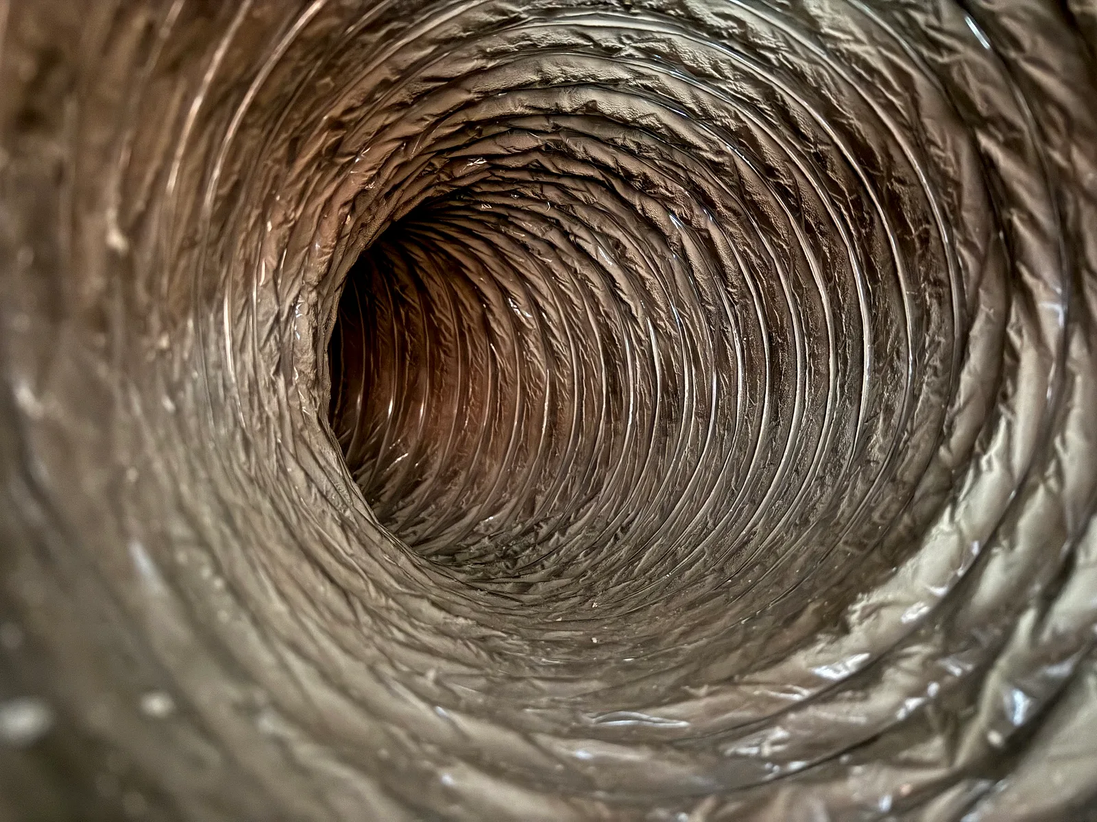 After cleaning: clear flexible dryer vent path with restored open airflow